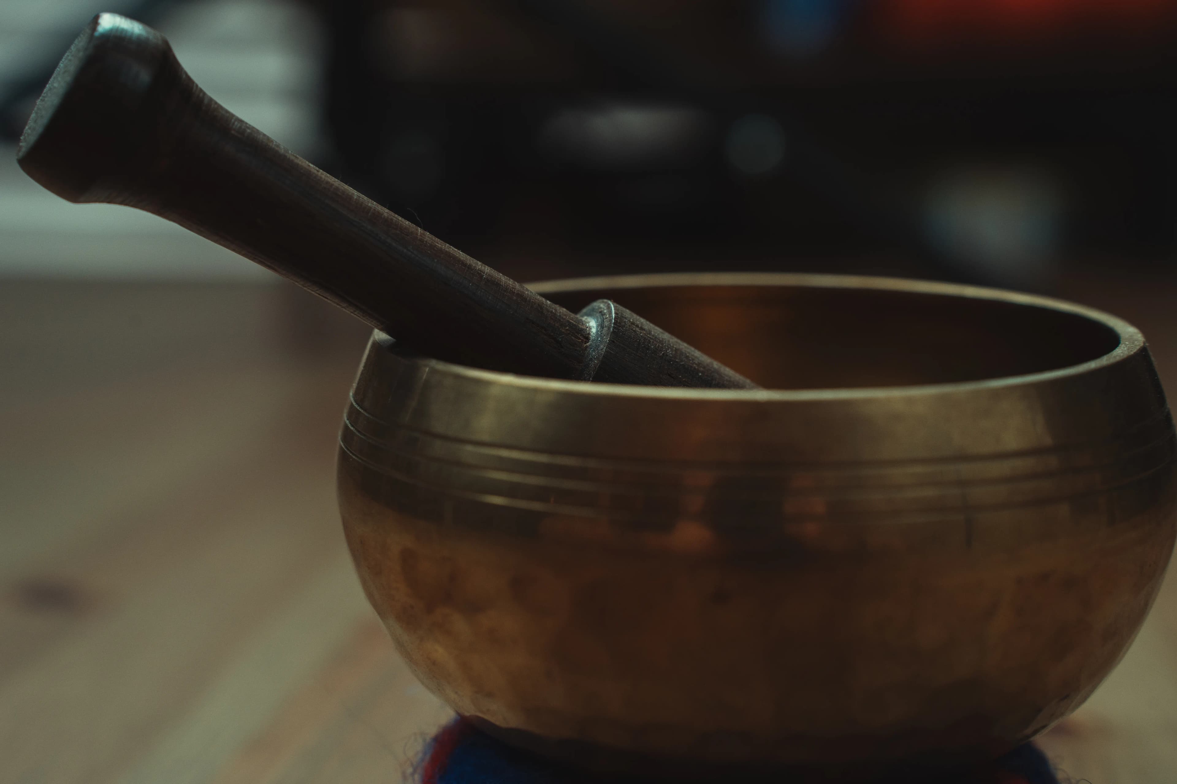 Singing bowl with wooden mallet for striking and rimming